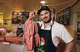 Co-owner Shane Artemis shows off the super sausage. Picture: Elle Borgward d408155