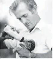 Former lion park manager John Gilbertson feeding a cub. PIcture: Wanneroo Regional Museum