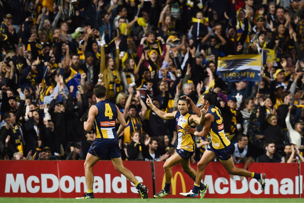 West Coast Eagles’ Sharrod Wellingham celebrates with teammates Josh Hill and Dom Sheed during Saturday night’s preliminary final victory over North Melbourne. Picture: Jon Hewson. d444347