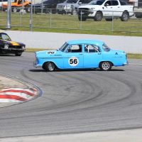 Gary Crosswell's Holden FE does an unplanned 360 in front of Stuart Young. Pictures: Travis Barnes