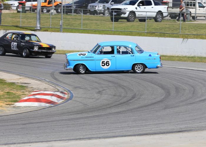 Gary Crosswell's Holden FE does an unplanned 360 in front of Stuart Young. Pictures: Travis Barnes