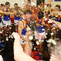 Brayden Ainsowrth and Brendan Ah Chee cop a Gatorade shower after beating GWS on Saturday. Photo: Getty