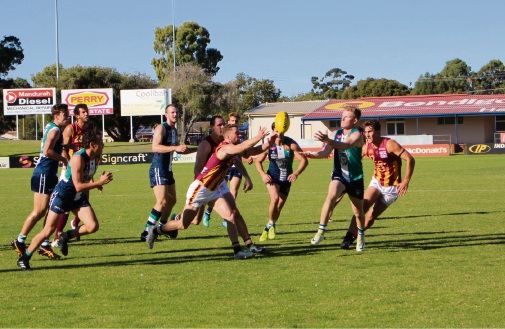 Peel and Subiaco gather to wrestle for the ball.