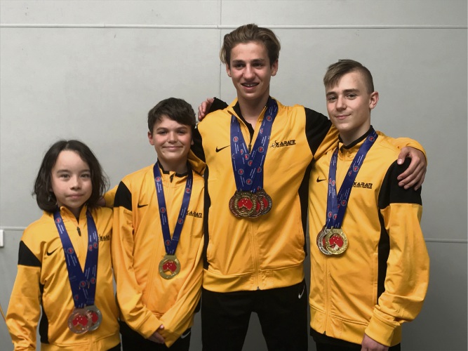 Brian Mackie Karate Life students Teo Roberts, Lucca Barnaba, Jes Bromley and Jamie Kafetzis with their medals.