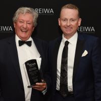 REIWA president Damian Collins (right) with Kevin Sullivan Memorial Award winner Ian Cornell.