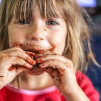 Little girl with a face full of chocolate. Picture: iStock