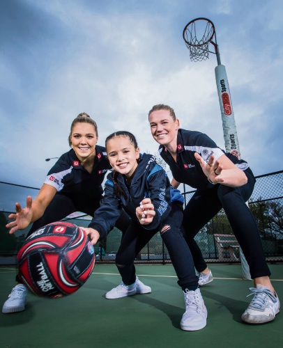 Australian Diamonds Kate Moloney and Caitlin Thwaites with 8-year-old Zodia.