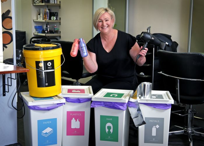 Janine Radford (Owner, Bassendean Hair and Makeup Studio) with her recycling bins in her sustainable hair salon. Picture: David Baylis. www.communtitypix.com.au d495642