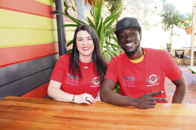 Evie Grace Foundation founder Maddi Kent with musician Macmillan Muyola, stage name Afroking.