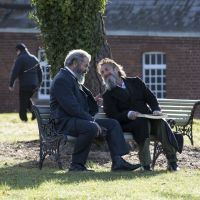 Mel Gibson as James Murray and Sean Penn as William Minor in The Professor and the Madman.