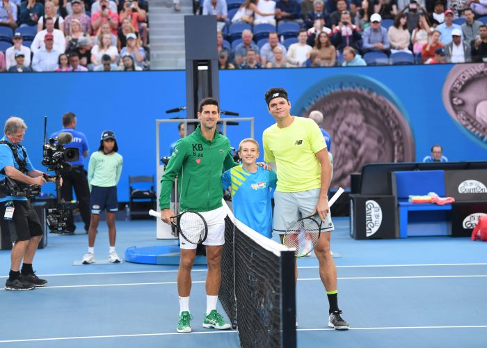 Novak Jacimovic between tennis stars Novak Djokovic and Milos Raonic at the Australian Open