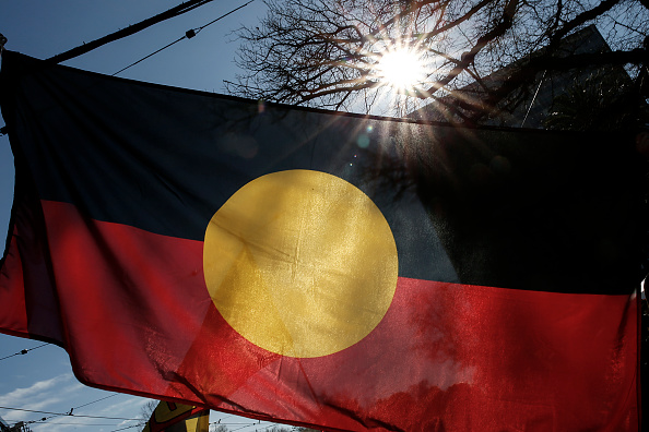 The Indigenous Flag is seen flying during a NAIDOC March. Picture: Darrian Traynor/Getty Images