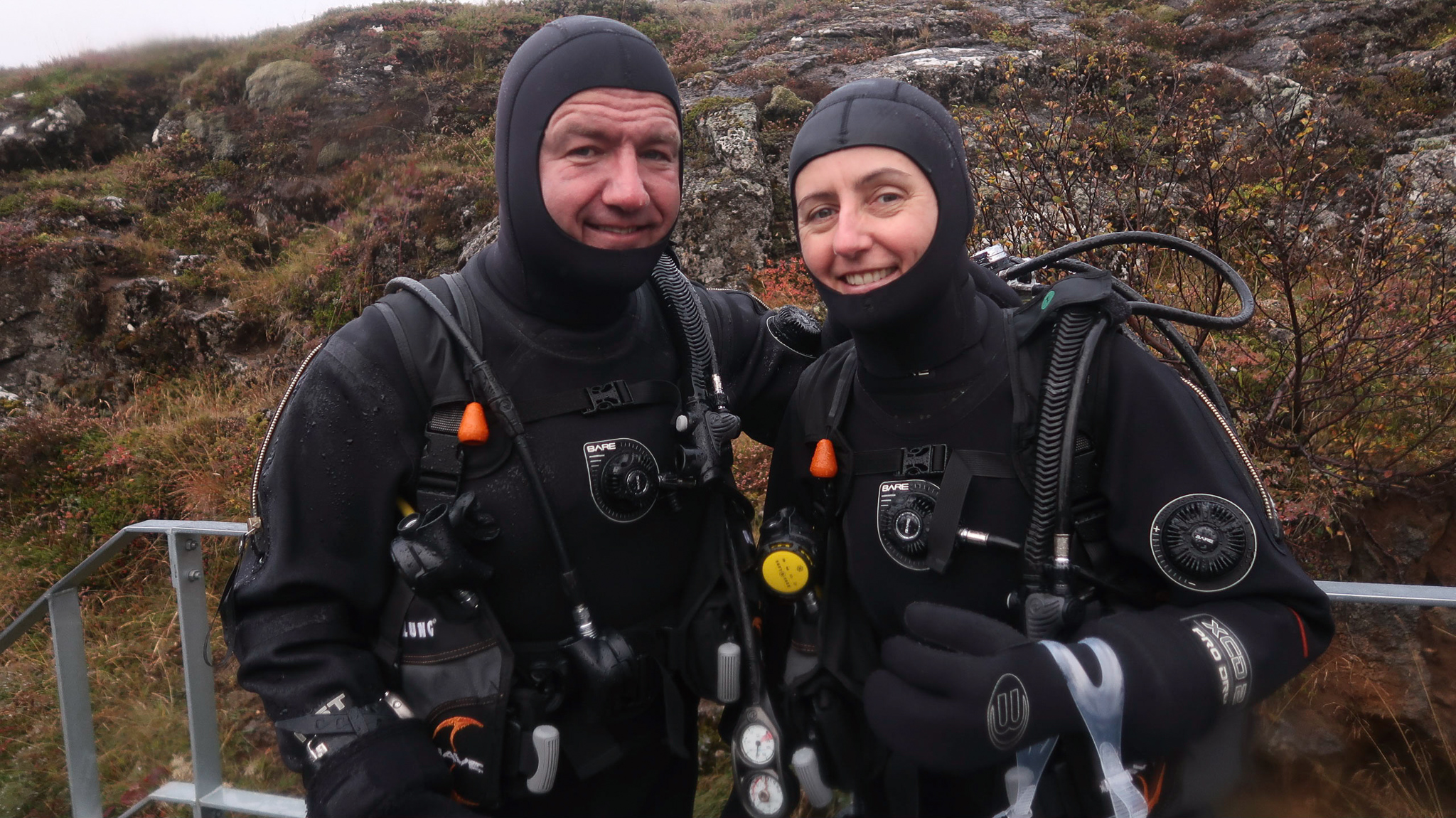 Des & Belinda kitted up and ready to dive at Silfra Fissure in Thingvellir National Park, Iceland. Photo by Tania Roque of DIVE.IS