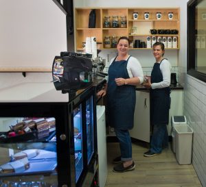 Carmen and colleague brewing up coffee