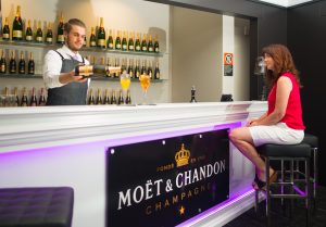 Ash prepares champagne cocktails at Lush Bar.