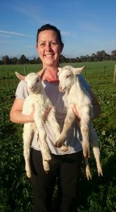 Melissa Jacka with some of the property's saanen dairy goats.