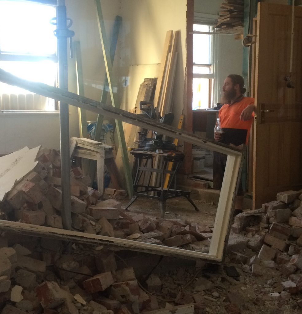 Builder Antony Maney during early renovations.