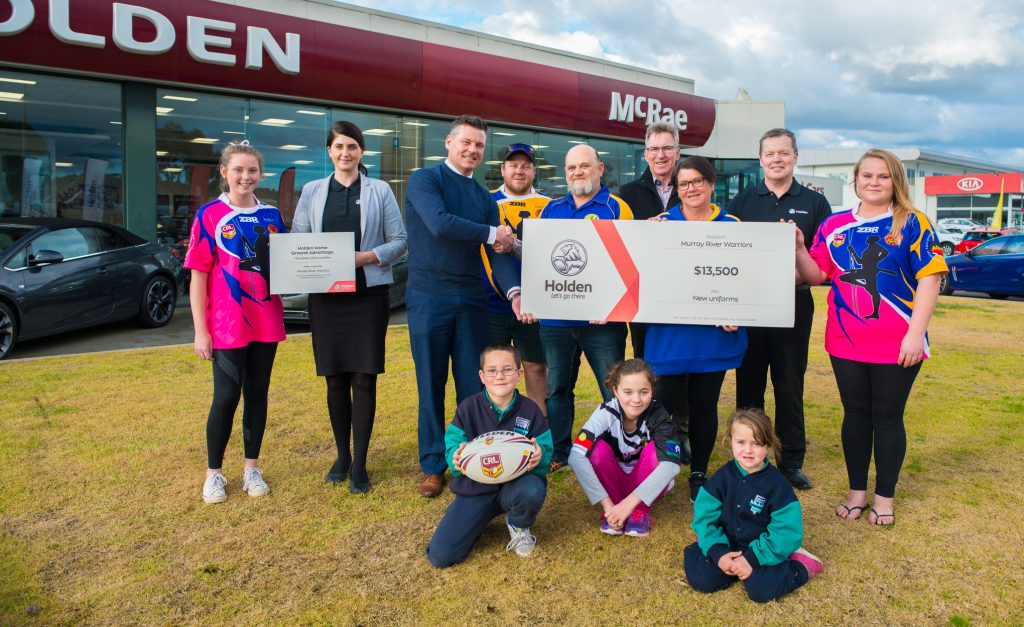 Players, Holden & McRae Motors representatives and AlburyCity Mayor Kevin Mack join the cheque handover celebrations.