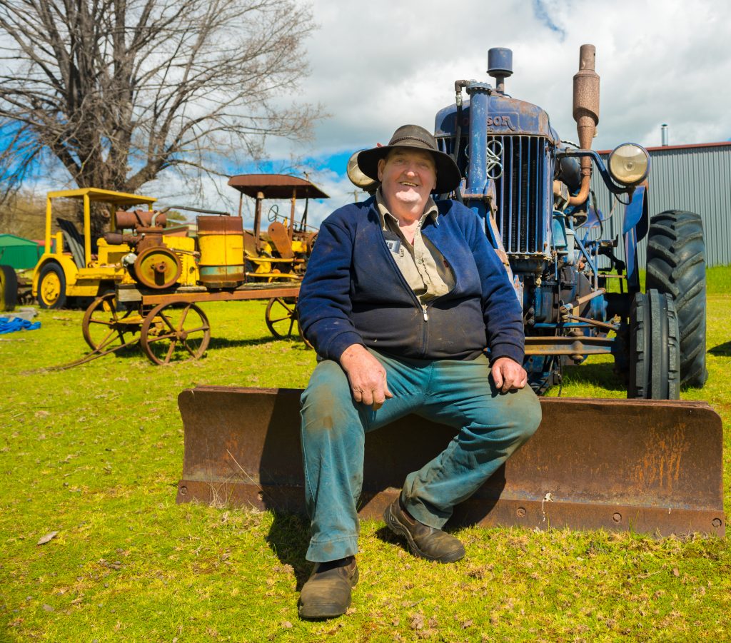 Bruce 'Trig' Tregilgas at home among some of his historic tractors.