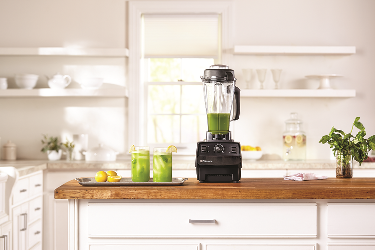 The Total Nutrition Centre blender sitting on a kitchen bench.