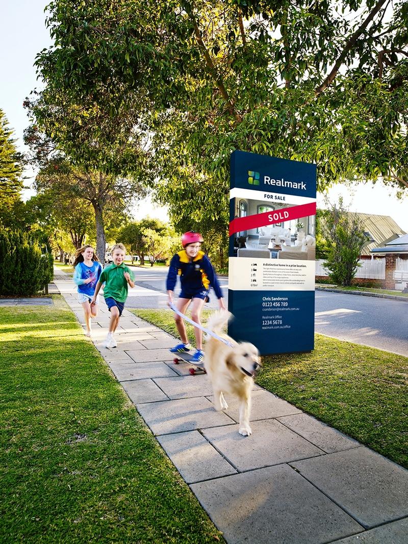 Children running past a property that has been sold by Realmark. Children running past a property that has been sold by Realmark.