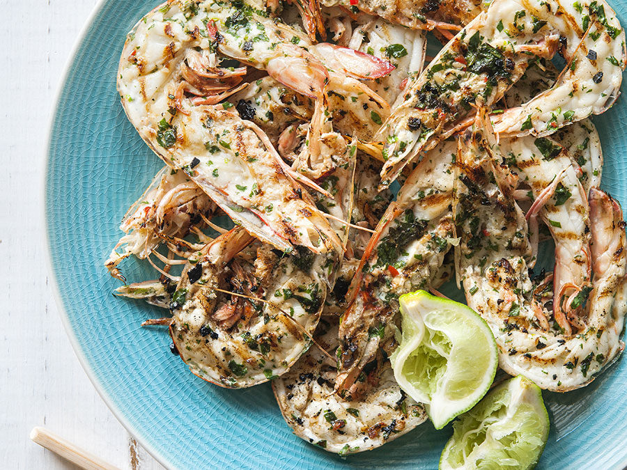 Asian style barbecued prawns halved in their shell & served with coriander, chilli & lime