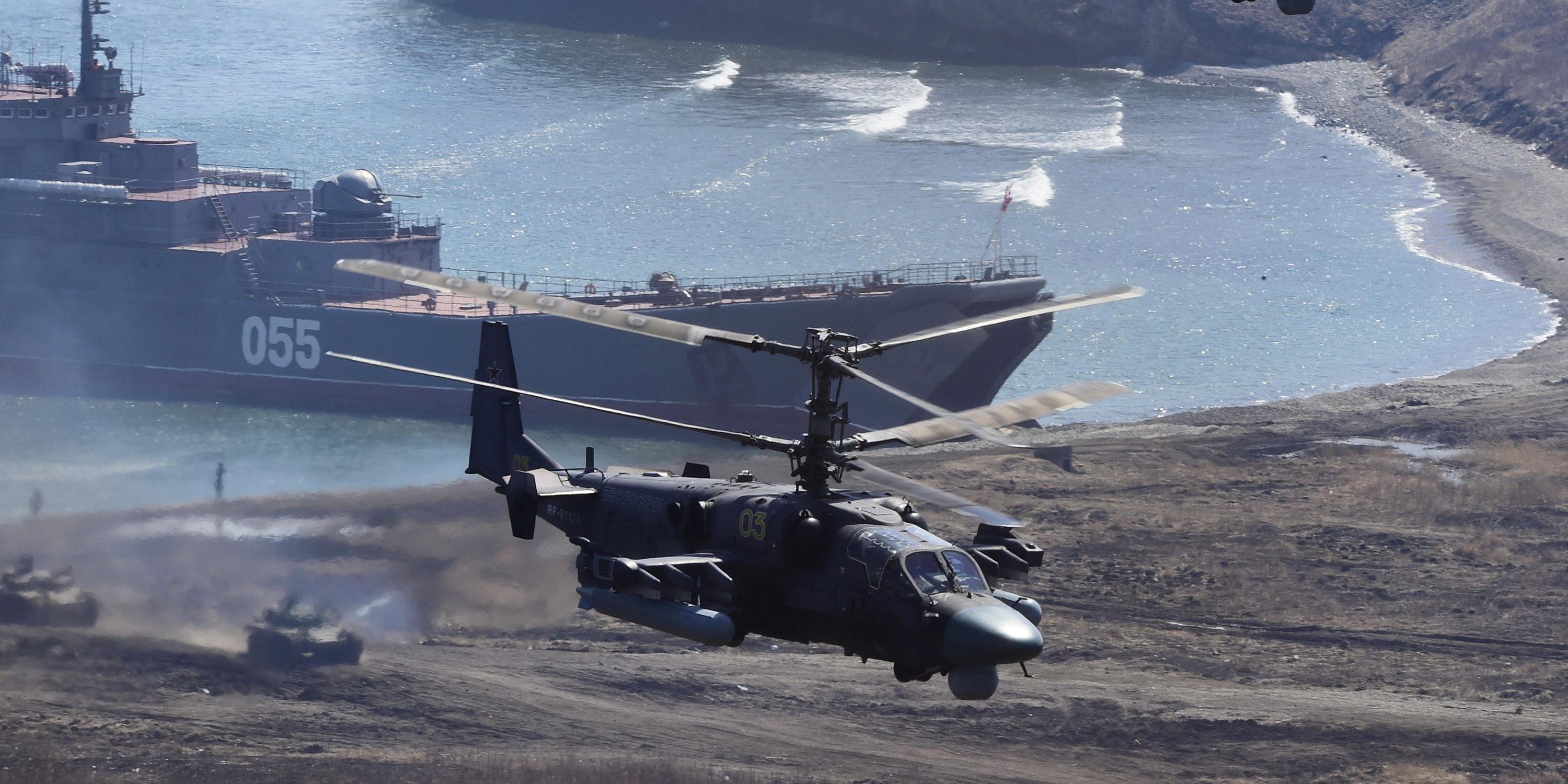 Kamov Ka-52 attack helicopters andT he Admiral Nevelskiy large landing ship take part in a military drill conducted by Russian Pacific Fleet’s marine regiments and Russian Eastern Military District’s mechanised infantry brigade at the Klerk range
