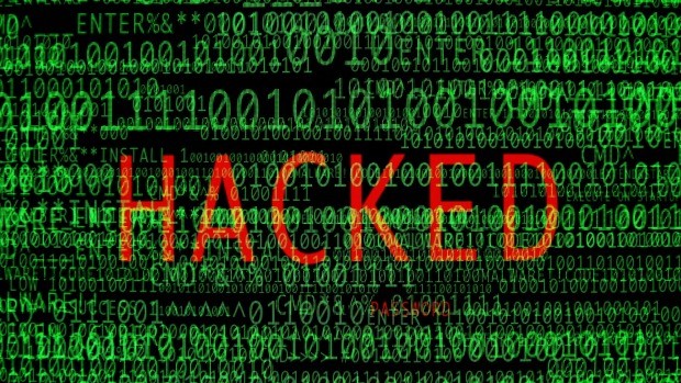 Computer code screen with the word "hacked" showing through in red