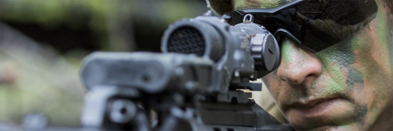 Australian soldier aiming weapon