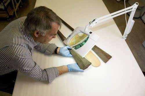 Curator Dr Nigel Erskine examines the Omai relics