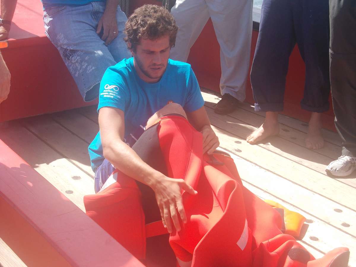 One of our voyage crew trying on an immersion suit