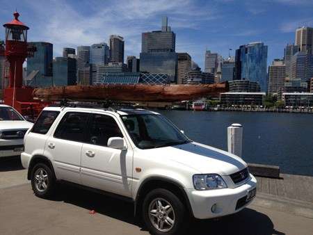 Bark canoe atop a car