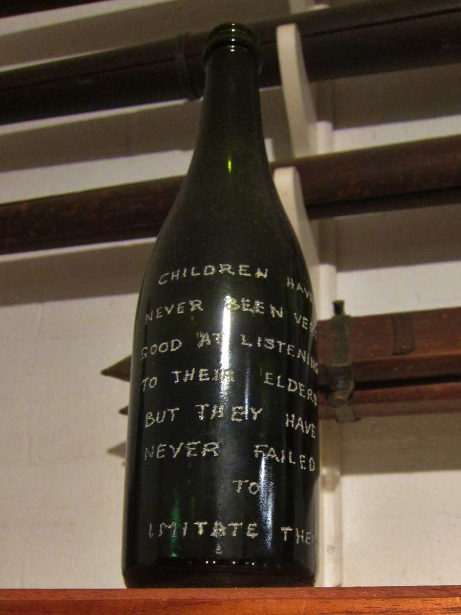 Engraved glass bottle