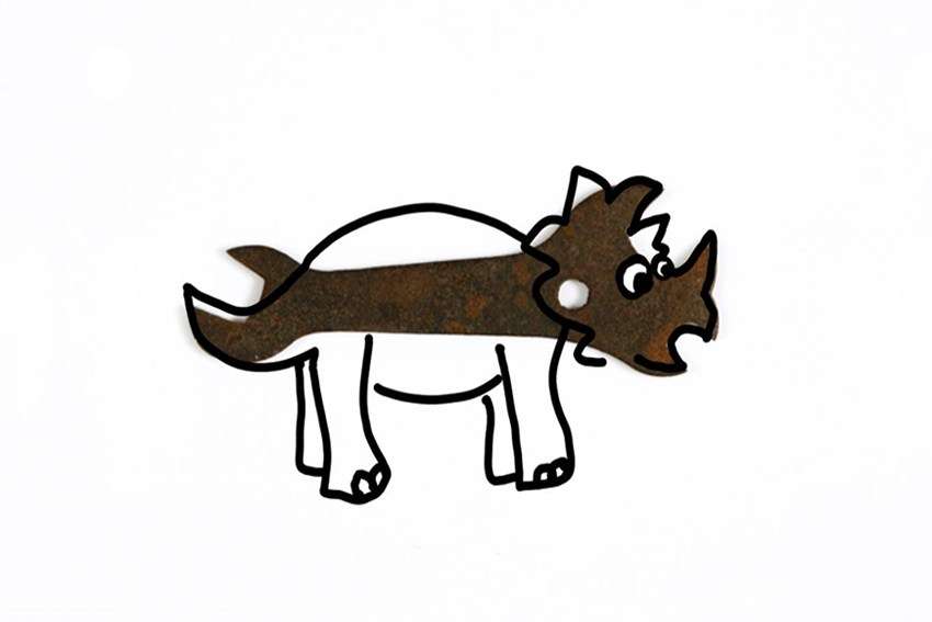A multi-wrench with a triceratops drawn over the top