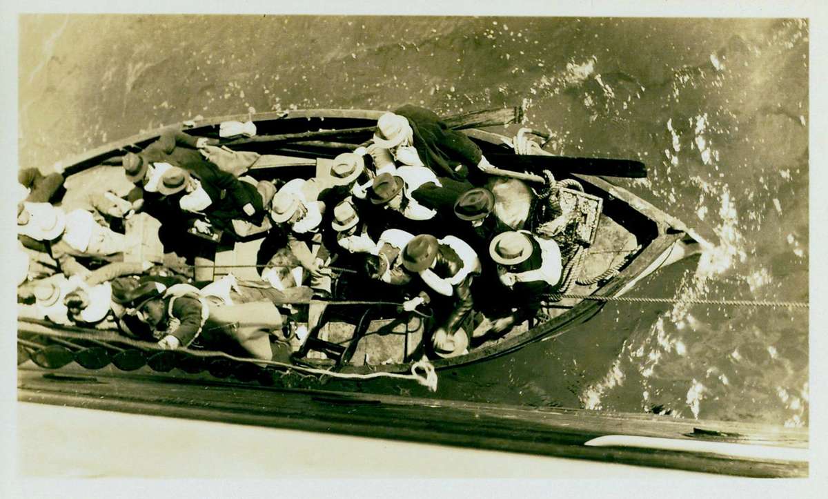 Passengers of the sunken liner TAHITI await transfer to VENTURA