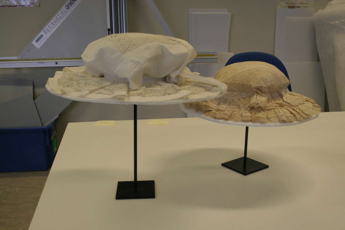 Hats are stored separately using internal supports on hatstands.