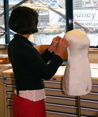 Sue standing with padded body form on stand