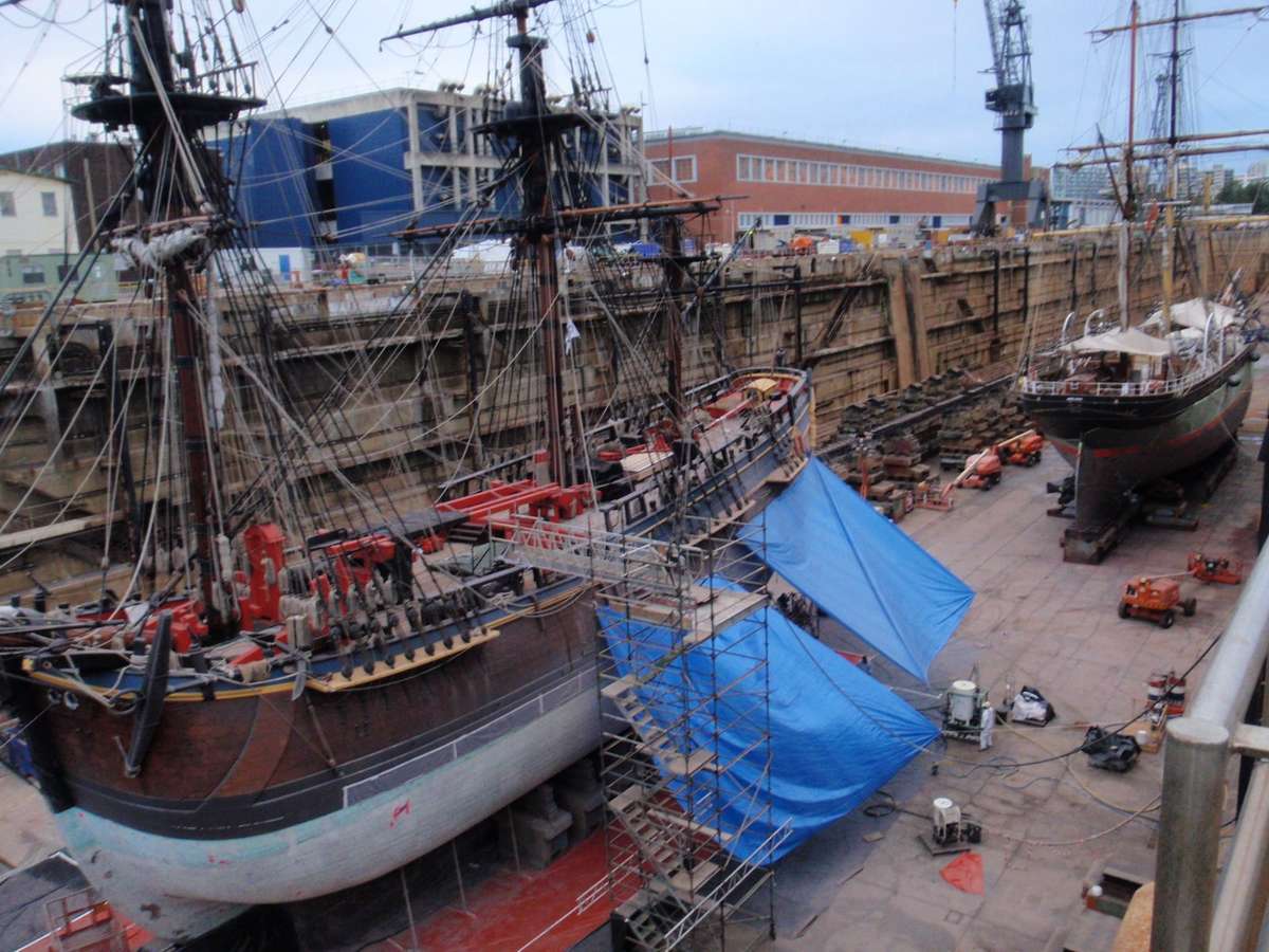 HMB Endeavour replica (front) and James Craig (background) in the Captain Cook Graving Dock at Garden Island, Sydney.