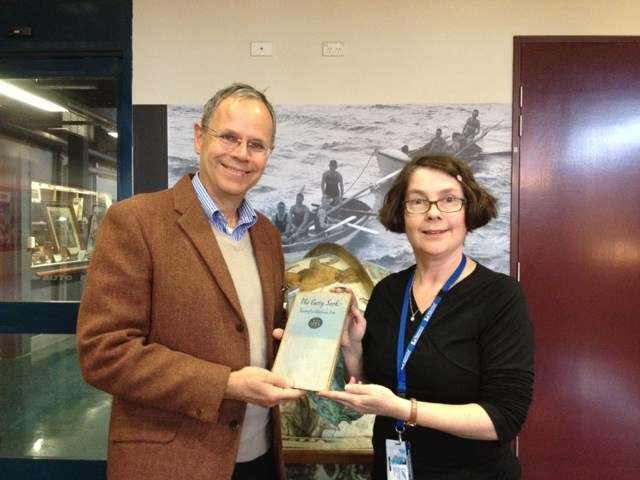 Simon Malcolm donating the book to Museum Librarian Frances Prentice