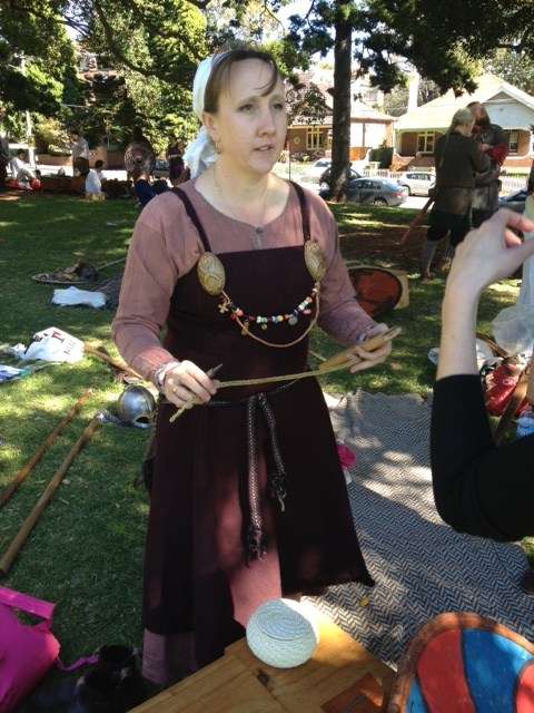 A Viking reenactor making wire jewlery