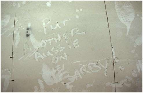 Photo of writing in dust on bottom of boat