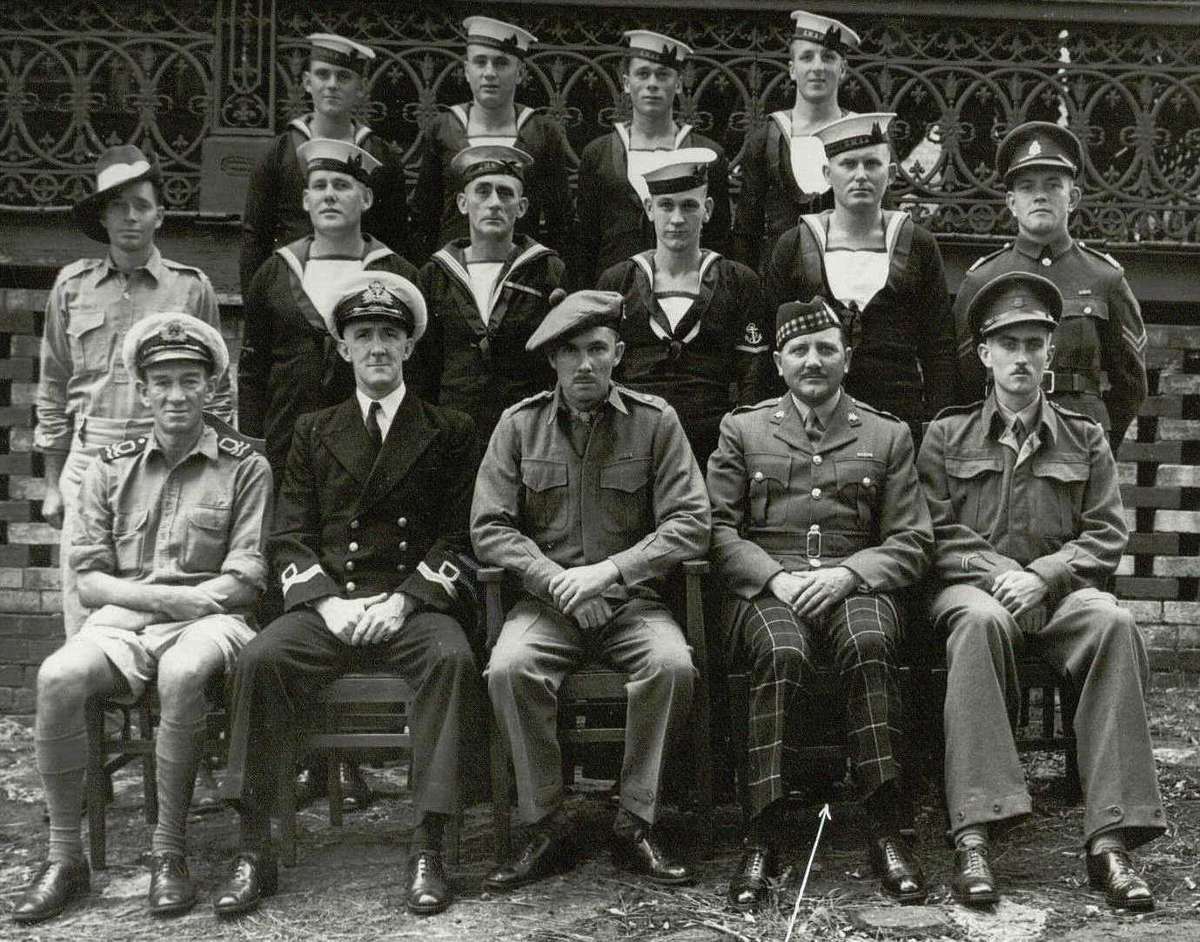 The men of Operation Jaywick. Backrow: AB Mostyn Berryman, AB Frederick Walter Lota Marsh, AB Arthur Walter Jones, AB Andrew William George Huston. Centre: Cpl Andrew Anthony Crilly, LS Kevin Patrick Cain, LDGSTO James Patrick McDowell, L/TEL Horace Stewart Young, AB Walter Gordon Falls, Cpl Ronald George Morris. Front: Lt Hubert Edward Carse, Lt Donald Montague Noel Davidson, Major Ivan Lyon, Major H A Campbell (did not accompany the expedition), Lt Robert Charles Page.