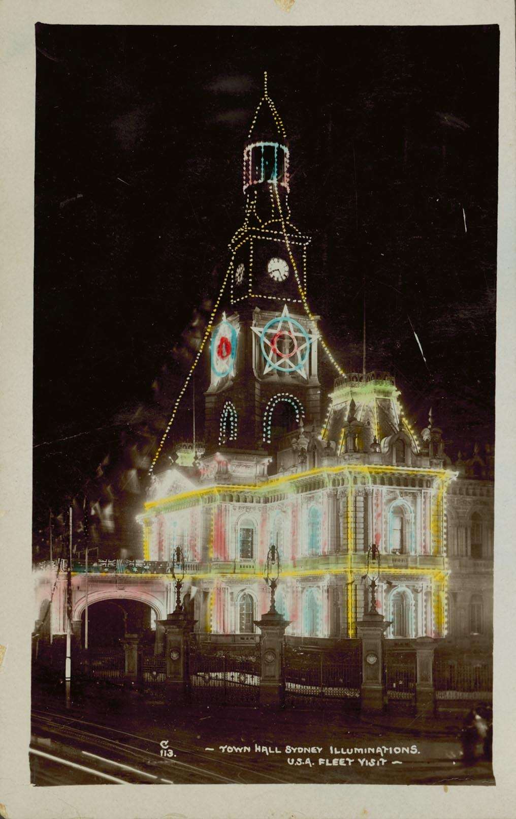 Hand coloured postcard depicting Sydney Town Hall illuminated during Great White Fleet visit in 1908. ANMM Collection