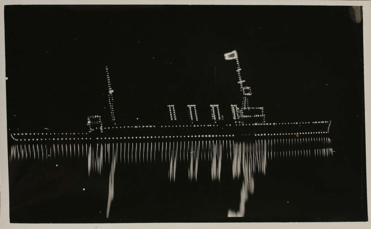 HMAS Sydney illuminated on Sydney Harbour on 4 October 1913 ANMM Collection Gift from Margaret Kiley-Balas