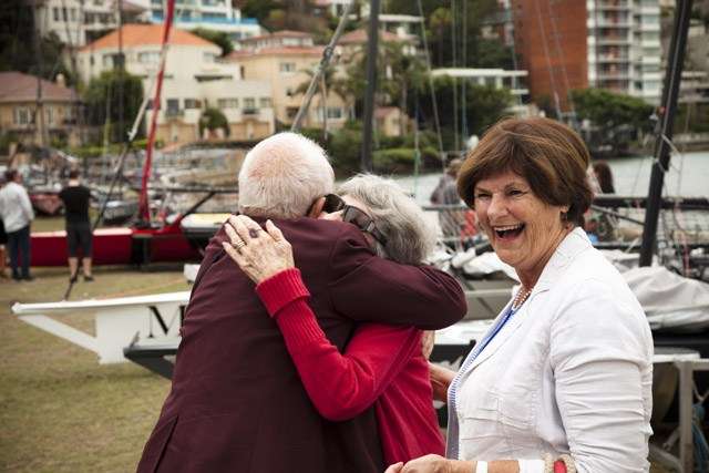 Brian Stewart greets Glory Barnett, with Cynthia Wallace (née Barnett). Photo by ANMM photographer Zoe McMahon