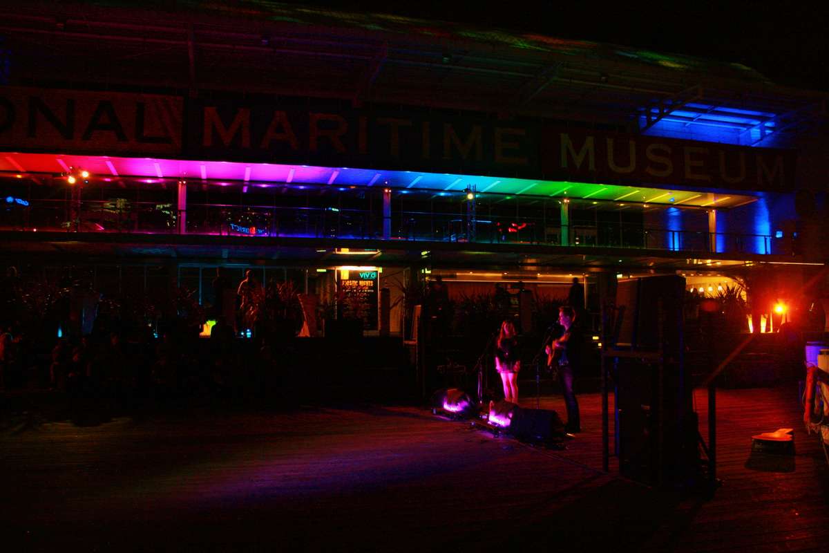 Lane and Jackson performing under a rainbow filled colour scheme.