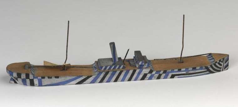 A painted wooden waterline ship model created during WWI to test dazzle paint schemes. Imperial War Museum Collection