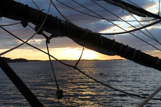 A kayaker circles Endeavour at anchor in Nelson Bay, Port Stephens. Photo: SMM.