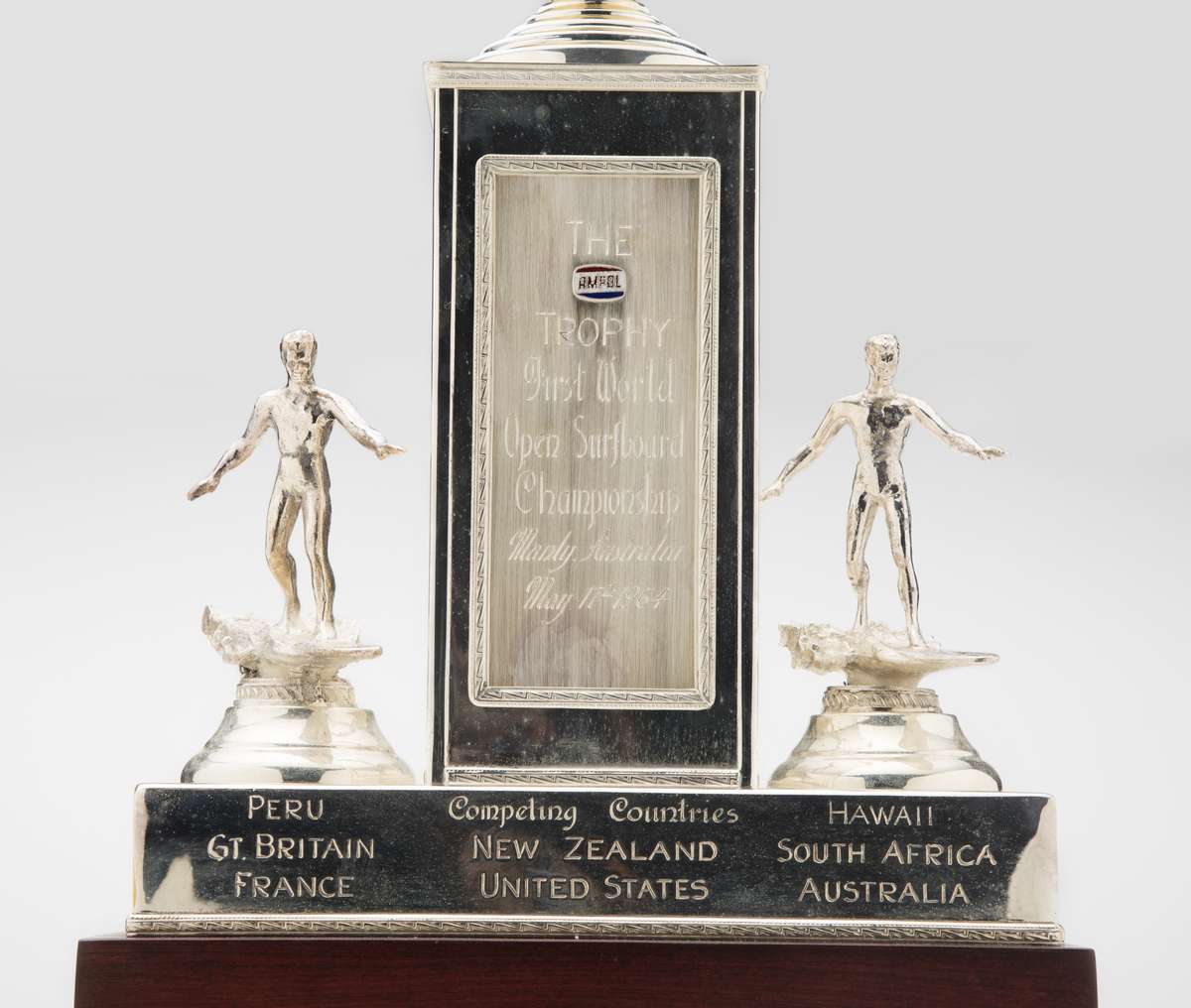 Ampol trophy for the first world open surfboard championship, Manly, Australia, maker unknown, silver plated base metal. Men’s final won by Bernard ‘Midget’ Farrelly 17 May 1964. Gift from Bev Farrelly and family in memory of Bernard ‘Midget’ Farrelly. ANMM Collection 00054955.