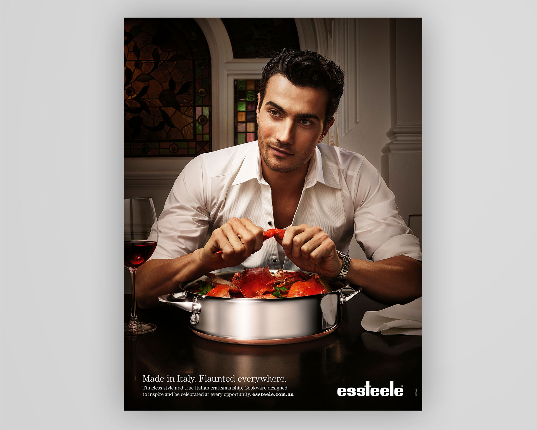 Essteele cookware | Handsome man eating crabs out of a stainless steel cooking pot | Magazine Ad